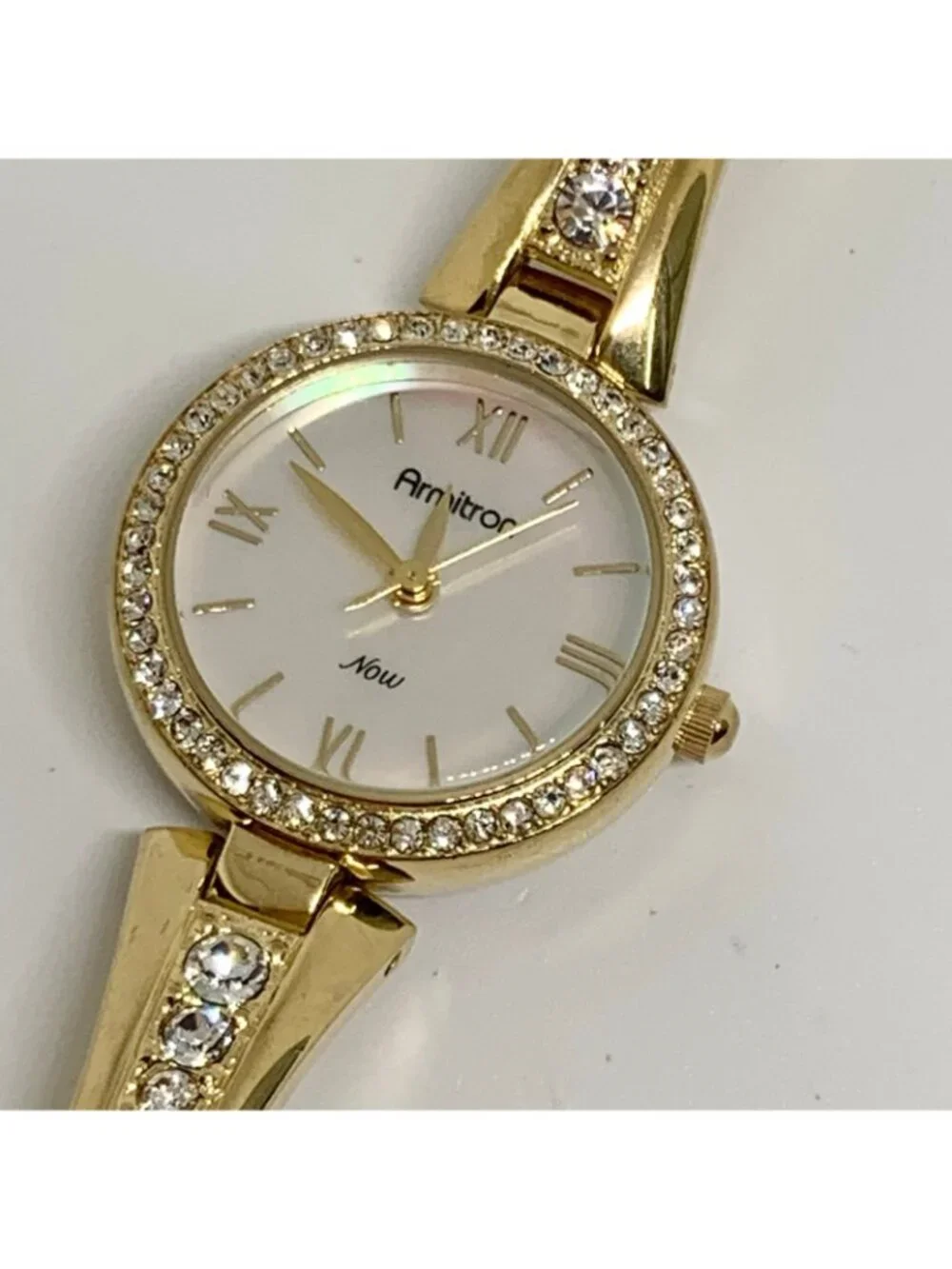 Armitron women’s watch gold tone 24mm mop dial quartz rhinestones running